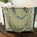 Quilted paisley-patterned tote bag in olive green.