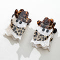 Two ghost-shaped hair clips with tortoiseshell accents on a white background