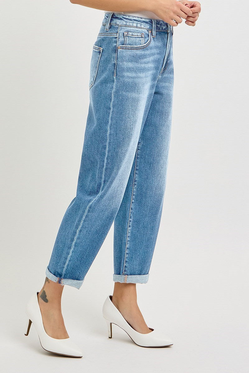 Blue jeans worn by a person on a white background